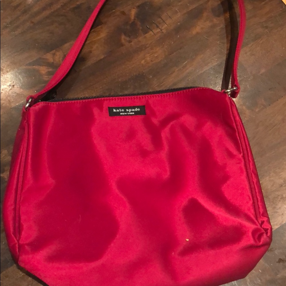 New with papers red satin Kate spade purse